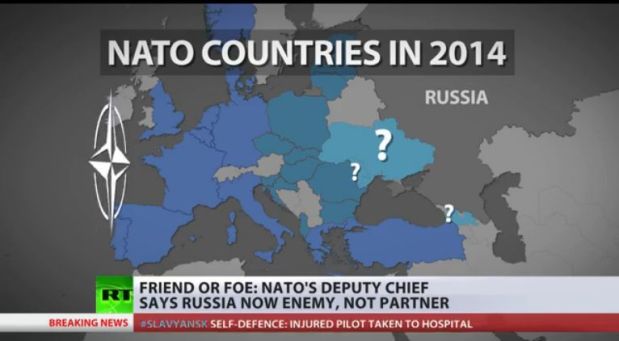 Les pays de l'Otan en 2014, saisie d'écran, Russia Today, 2 avril 2014. Les points d'interrogation indiquent, de haut en bas, l'Ukraine, la Moldavie, la Géorgie, qui sont candidats à l'entrée dans l'Otan. Le 1er mai 2014, le ministre géorgien de la défense a laissé entendre (il a "demandé" à l'Otan que) que l'Otan pourrait bientôt installer une base militaire sur son territoire (une "base militaire" qui ne porterait évidemmment pas ce nom).